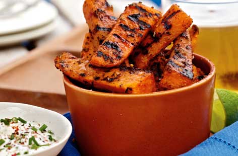 Use up leftover sweet potatoes with this easy, healthy recipe. The chips are enhanced by the lovely herby, lightly spiced seasoning. Sour cream sauce with a few chives scattered over the top, makes the perfect accompaniment.