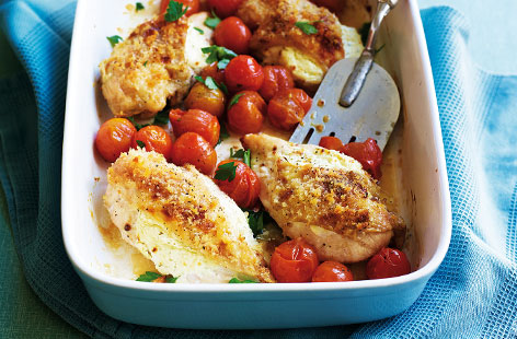 An oven-baked one-pot chicken dish. Here succulent chicken breast is coated with herby cream cheese and breadcrumbs before being roasted in the oven with cherry tomatoes. Top tip: finish under the grill to crisp up the chicken skin.