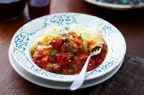 Chicken, when slow-cooked, becomes tender and irresistible. This recipe conjures all the flavours of the Mediterranean with its bold garlic, rosemary, and capers gently simmering in a rich tomato sauce with chicken thighs.