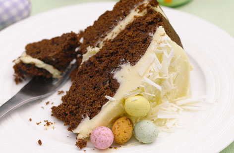 Treat the family this Easter with this rich chocolate cake. Fudgy chocolate sponges are sandwiched with creamy white chocolate buttercream and decorated with mini eggs for the ultimate teatime treat.