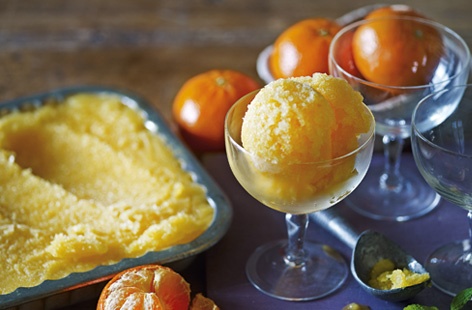 A lighter dessert for the Christmas season, this clementine sorbet is the perfect way to round off all those rich meals. Sugar, lemon juice, and clementine zest and juice are frozen then churned until a perfect consistency has been obtained. Garnish with pretty mint leaves.