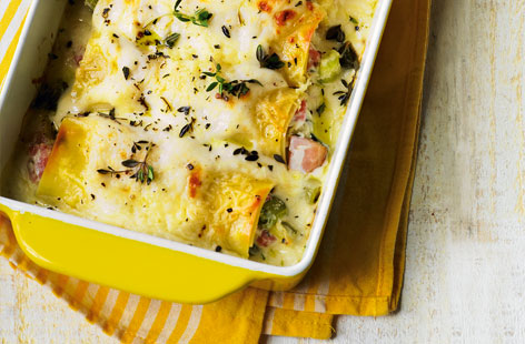This creamy ham and leek cannelloni is a comfort food classic. Leeks are softened then stirred into ricotta cheese and torn pieces of ham before being rolled into fresh lasagne sheets. The cannelloni are then topped with cheese sauce and baked until golden and bubbling.