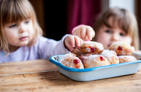 These light and delicious jam-filled doughnuts are so fun to make, with lots of opportunities for children to practice their kneading, rolling and piping skills.