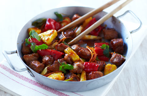 Rustle up this popular Chinese dish of succulent pork fillet, fresh pineapple and veggies marinated in a sticky sauce