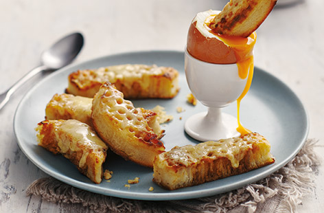 Give your breakfast soldiers some extra oomph by layering up crumpets with a seriously savoury cheese topping. 