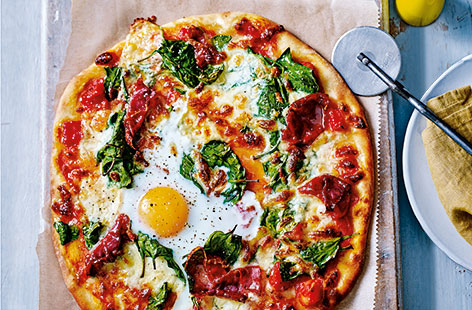 Silky spinach, tangy tomato and salty Parma ham top a traditional pizza base, finished with a perfectly cooked egg. This traditional Italian Florentine pizza recipe boasts vibrant flavours for a delicious dinner idea that's perfect for sharing.