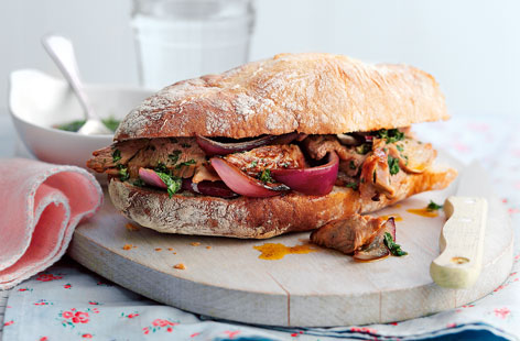 A luxury sandwich for the home worker to brighten up the day, here griddled lamb steaks sprinkled with paprika are stuffed in a warm ciabatta with softened red onion and a homemade mint sauce: A steak sarnie with a difference.