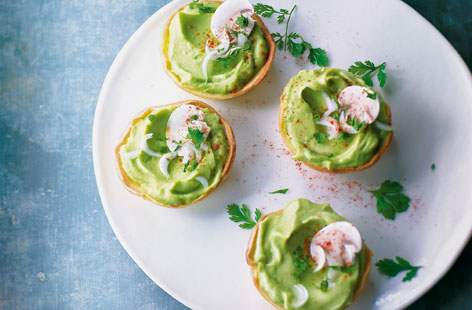 Guacamole is spooned into pre-cooked or ready made tartlets for this perfect party appetiser. To make perfect guac, add the juice of one lime per mashed avocado, then mix in chopped coriander, chilli, spring onions, and in this instance, finely chopped mushrooms before seasoning to taste.