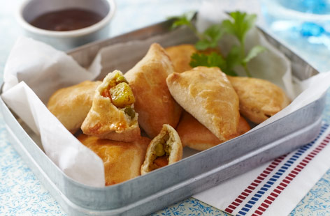 There are few foods on Earth that contain as much joy within them as a simple samosa. This vegetarian versions – stuffed with a traditional mix of carrots, potatoes, onions, and peas – are best served piping hot alongside a generous spoon of mango chutney.