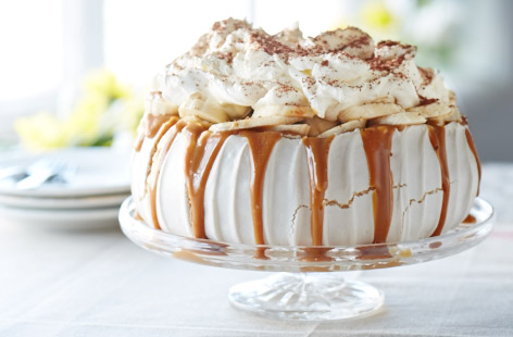 Banoffee pie meets Pavlova in this delicious dessert. Finished with a caramel drizzle and topped with pillowy cream and slices of banana, it is sure to impress. 
