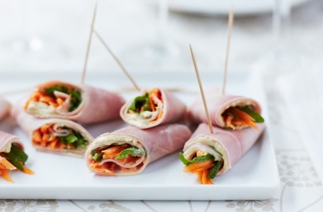 A quick and healthy snack that works as a canapé or as a lunch that even picky children will enjoy. Simply wrap houmous and OJ-soaked grated carrot and rocket in slices of ham and secure with cocktail sticks.