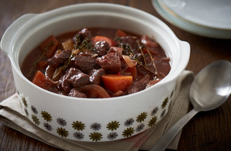Warm up a cold winter's day with this delicious beef and red wine casserole. Wintery root veg such as swede and carrots, and aromatic rosemary and thyme meld together beautifully after several hours in the slow cooker.