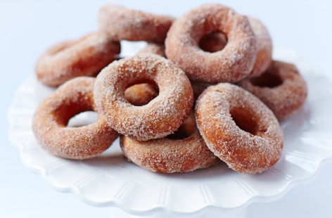 One of life's great treats, these light and fluffy doughnuts dusted in cinnamon sugar are the perfect sneaky treat. Serve warm with a cup of tea, and try not to eat the whole lot in one go. The best bit? You can save the holes to make mini jam doughnuts later on.