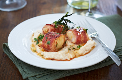 A great dish for two; these scallops are wrapped in a thin slice of pancetta and seasoned with fresh parsley and rosemary – ideal for a delicious starter or light lunch.