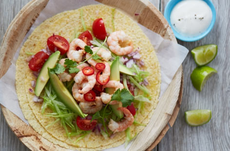These fresh, spicy and zingy tacos are generously piled with sweet king prawns, creamy avocado and a zesty homemade salsa. Finish this super speedy meal for two with an indulgent dollop of sour cream on top.