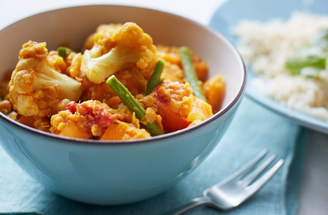 Try our delicious veggie dhansak recipe for your next curry night. Dhansak is a sweet, sour and spicy Parsi dish, featuring creamy lentils. Our recipe includes lots of root veg, cauliflower and green beans. It's warming, filling and tastes like a real treat! Serve with fluffy white rice.
