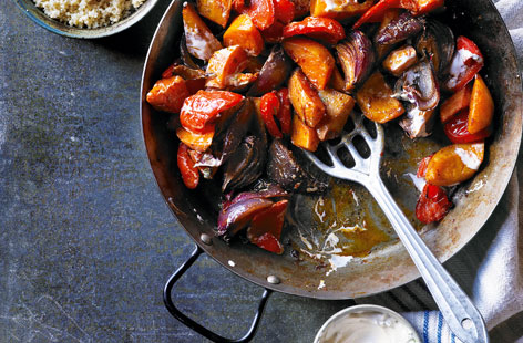 This veg-packed dish is a simple chop, mix and roast affair. It uses harissa, an aromatic north-African chilli paste, to add a bit of heat, which is complemented by a cooling minty Greek yogurt dip on the side.