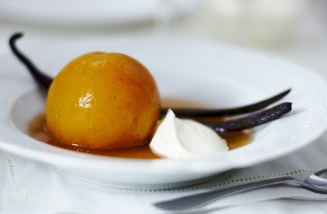 For this beautifully elegant dessert, four peeled ripe peaches are poached in a vanilla flavoured syrup until soft. The syrup is reduced and poured over the top of the poached peaches, along with a dollop of natural yoghurt.