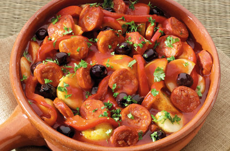 Deceptively quick to prepare, this flavourful Spanish one-pot stew will fast become a dinnertime staple. The combination of chorizo sausages, olives, potatoes and red wine is as comforting as it is exotic.