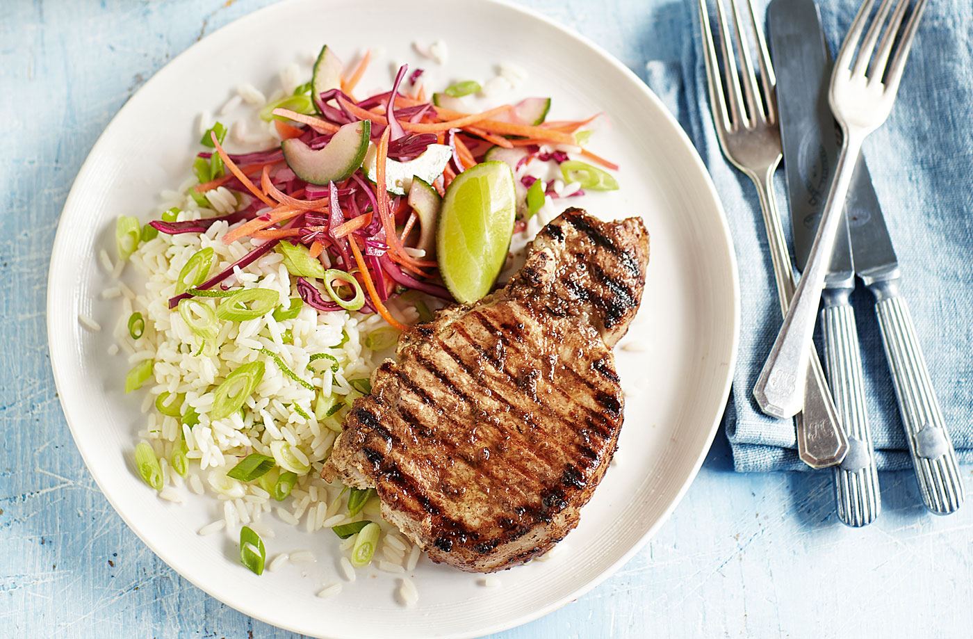 Jerk pork chops with lime rice and slaw recipe