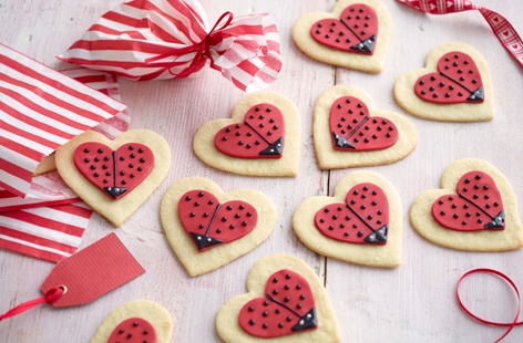 Make a batch of these sweet and funny love bug cookies, wrapped up with a ribbon for the perfect edible gift.