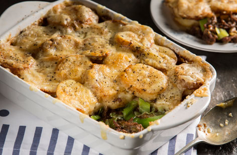 This tasty bake is a bit like a Cumberland pie, but with sliced potato instead of mash. The delicious cheesy topping and sprinkling of oregano elevate it. It's sure to become a new family favourite in the colder months.