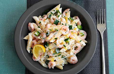 Lemon zest, chives and soft cheese form the base of the simple sauce used in this lemony prawn pasta recipe. Rich lashings of that citrussy sauce coat each al dente tube of penne; cooked and peeled prawns mean there's no faff in the preparation either.