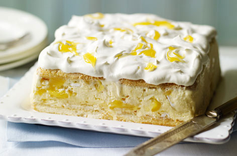 Summer in a dish. This light and zingy limoncello ice-cream cake is surprisingly simple to make but will impress guests when you bring it out as dessert. The limoncello, sweet meringues and lemon curd make this the perfect end to dinner al fresco.