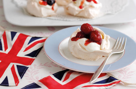 Master the art of meringues with these oh-so-pretty mini berry Pavlovas, topped with a dollop of whipped cream and a mix of fresh and juicy summer berries. They're a great dessert for enjoying al fresco