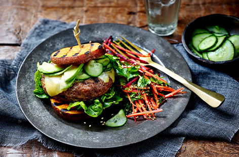 Barbecued sweet potato rounds are the hero of this burger recipe.  Add a succulent beef burger, cheddar cheese, avocado and quick pickled cucumbers and you've got a low carb burger recipe for any night of the week.