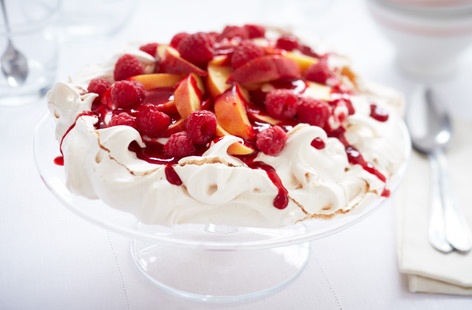 Topped with juicy nectarines and sweetly-tart raspberries, this pavlova is sure to be a huge hit with your guests.