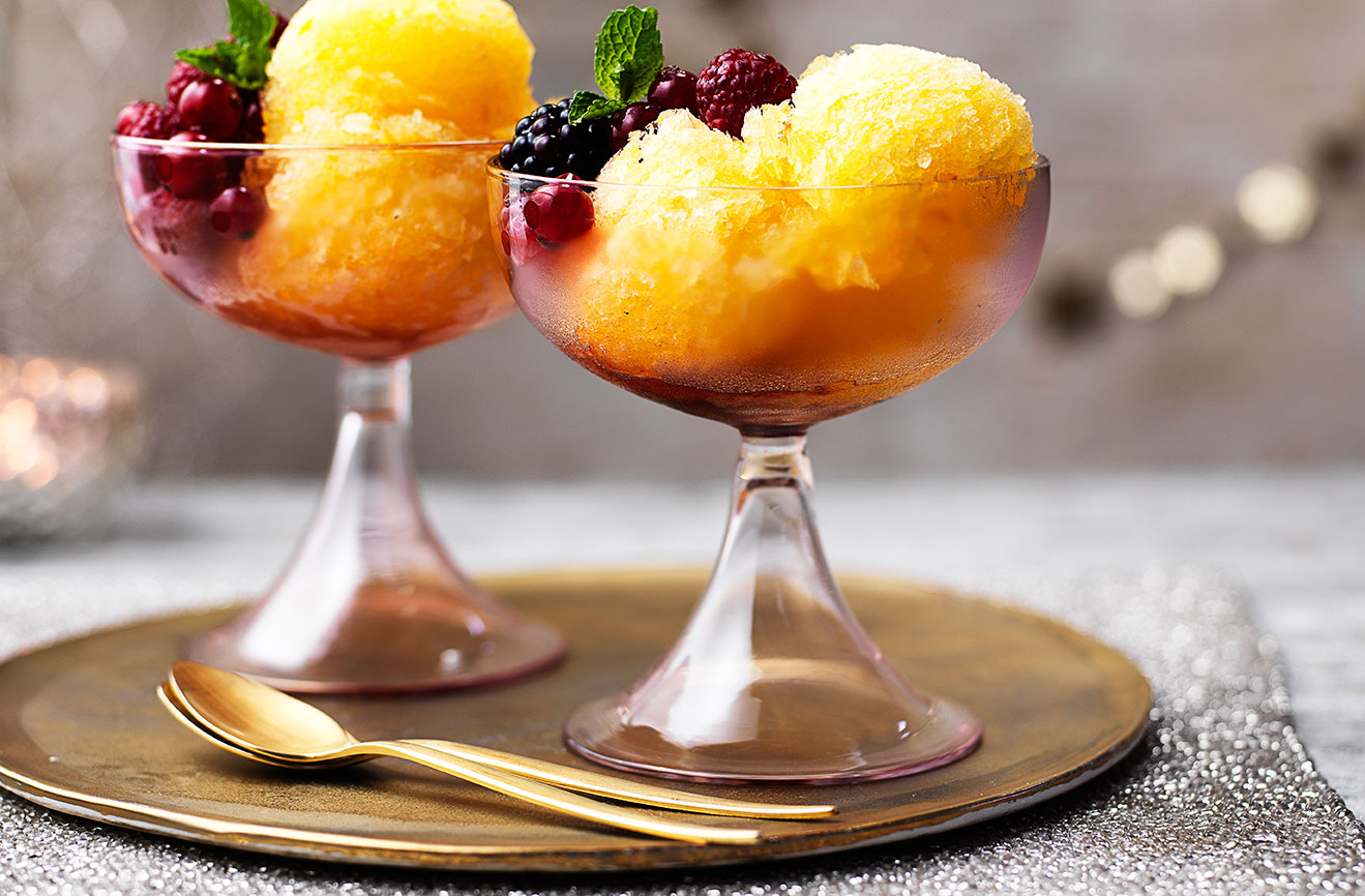 This stunning Christmas dessert is the perfect end to a special dinner party or celebration. Get ahead and make this easy dessert 3 days before needed – keep frozen and simply serve with boozy berries, a sprinkling of icing sugar and fresh mint