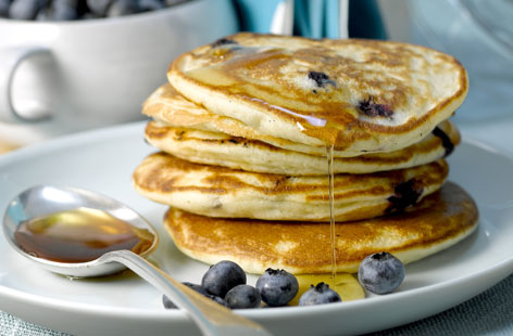 These classic blueberry pancakes are perfect brunchtime treat. Light and fluffy American-style pancakes are studded with juicy blueberries and best served with a drizzle of maple syrup - plus they have the bonus of being totally dairy-free.
