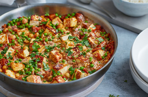 Frozen peas add a spot of colour and sweetness to this simple veggie curry