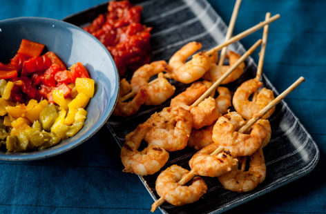 These delicious prawn skewers are quick and easy to prepare and go fantastically with this slightly spicy tomato chutney and roasted peppers. 