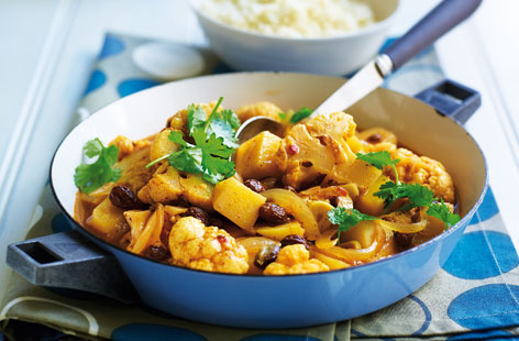 Cauliflower cooks in moments and is perfect in spiced vegetarian tagines. For this moroccan-inspired dish, softened onion, potato, cauliflower and olives simmer in stock until tender. Serve with fresh coriander and fluffy couscous.