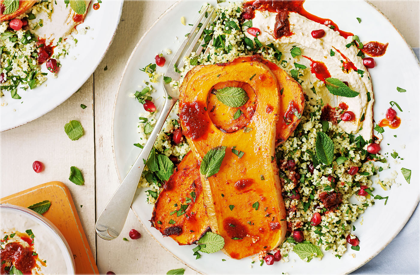 Butternut squash steaks with houmous and jewelled couscous recipe