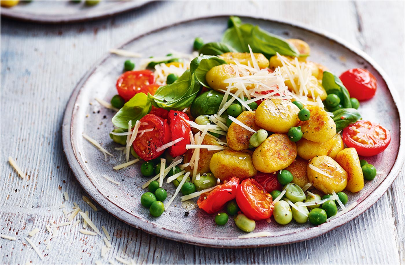 Crispy gnocchi with peas, broad beans and tomatoes recipe