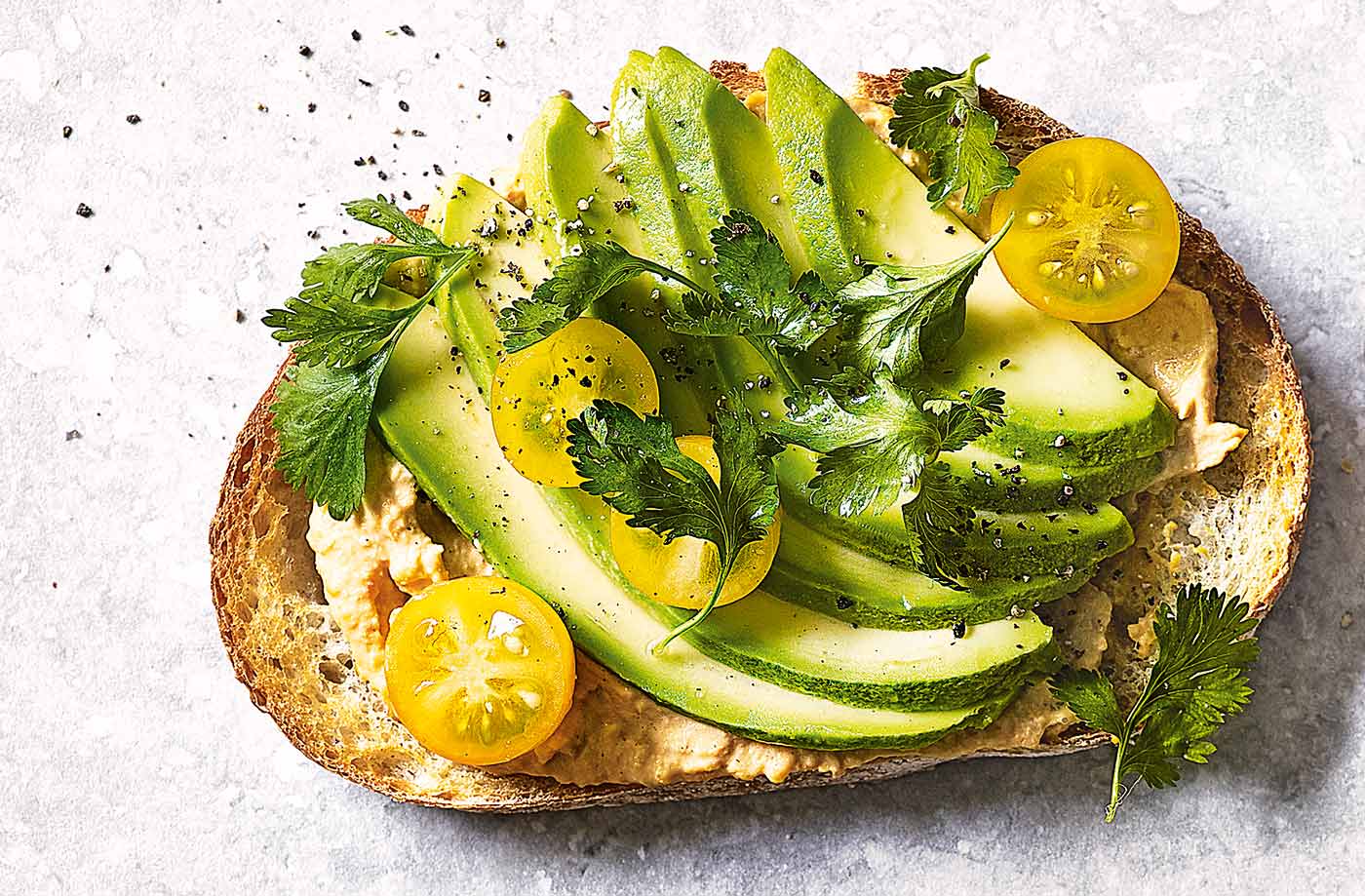 Houmous, avocado and yellow tomatoes toast topper recipe