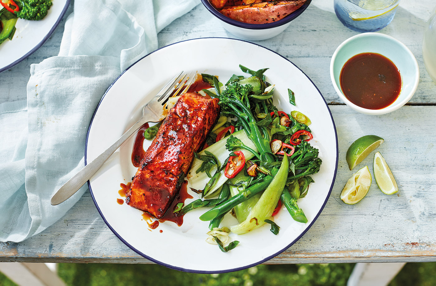 Rum-glazed salmon with wedges and chilli greens  recipe