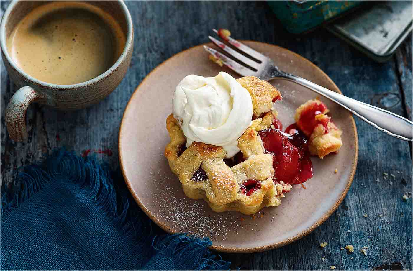 Practise your pastry skills with these gorgeous fruit tarts which have a crumbly almond pastry base and pretty lattice top. The fruity filling makes the most of seasonal plums and has a subtle spicy flavour from cardamom.