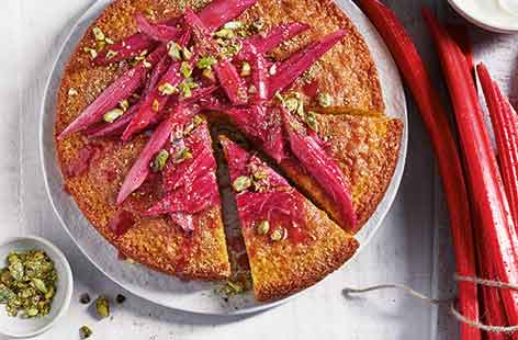 Vibrant pink stems of forced rhubarb, roasted until tender, are the prettiest topping for this zesty spring cake. Orange and rhubarb are a classic combination and polenta gives this cake a wonderful texture. 