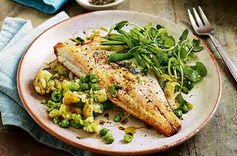 Pan-fried sea bass is a simple midweek meal ready in less than 30 minutes, but is equally smart enough for a dinner party dish. Serve the tender sea bass with a vibrant smashed pea and potato salad.