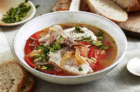 This Sicilian-inspired hake broth filled with red peppers and orzo is a delicious twist on a fish soup, perfect for warmer spring nights. Tender hake fillets poach in the fragrant broth to absorb all the flavours – serve with plenty of crusty bread to mop 