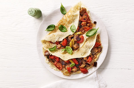 Try this delicious aubergine pancake recipe for a healthy dinner for two. Proving there is more to pancakes than just lemon and sugar, these golden savoury pancakes are filled with a summery veg sauce using soft fried aubergines and juicy fresh tomatoes.