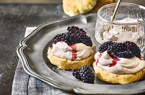 Give buttery scones a seasonal makeover with crème de cassis cream and tart autumnal blackberries