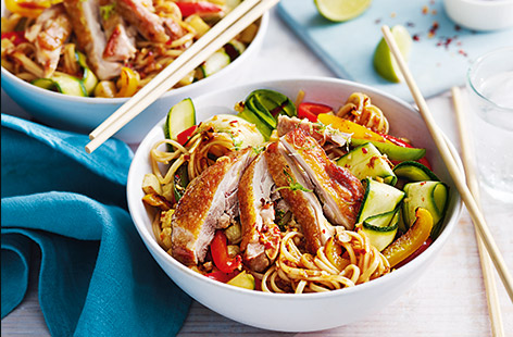 Pairing golden, crispy chicken thighs with sweet peppers, courgette ribbons, and egg noodles, gives a hearty stir-fry recipe that's great for busy weeknights