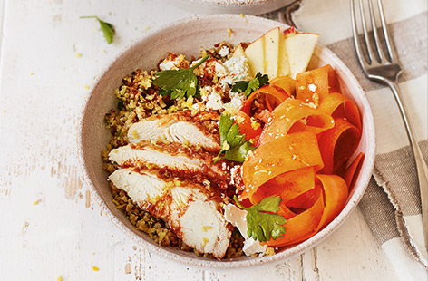 Pair crunchy carrots with apple and chicken in these easy grain bowls, topped with a zesty homemade dressing.