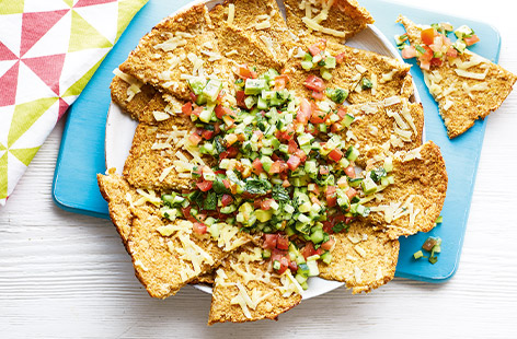Keep the kids happy over the summer holidays with this Mexican-inspired healthy snack recipe. Making your own nachos from spiced cauliflower instead of classic tortilla chips adds an extra portion of veg, perfect for pairing with the fresh colourful salsa.