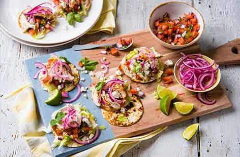 For a tasty Mexican snack, look no further than these crisp, colourful chicken tostadas. Steaming the fajita-spiced chicken in foil helps keep it lovely and moist, complementing the crisp tortilla base, crunchy lettuce and quick pickled red onion.